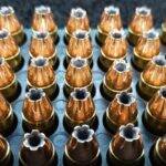 .380 Auto / ACP 100 grain HP Bulk Remanufactured Pistol Ammo in rows in an ammo tray
